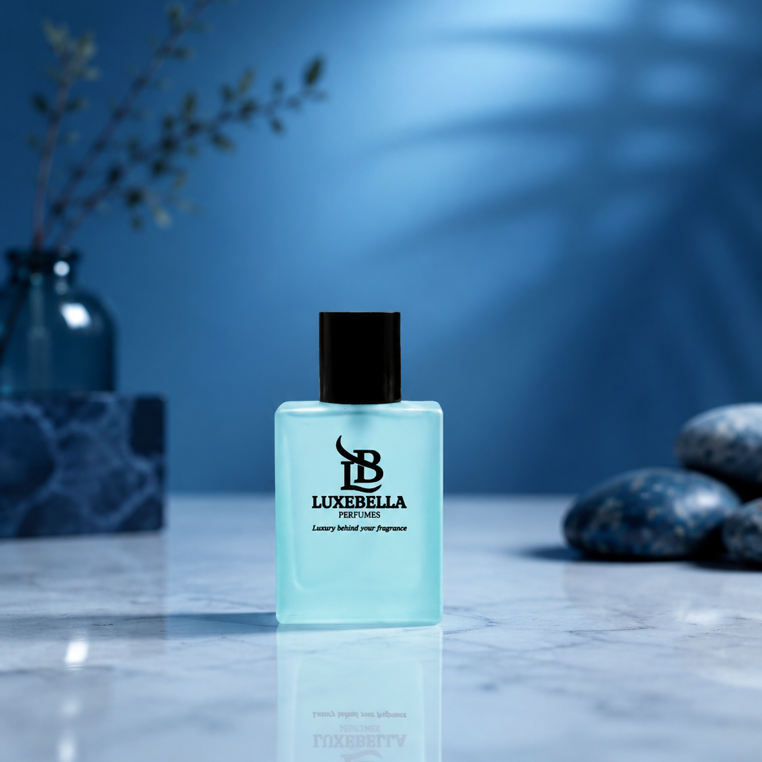 A bottle of Luxerella Holy Holy Oil Fragrance with a light blue translucent liquid and a black cap, displayed on a marble surface with a blue background and decorative stones.