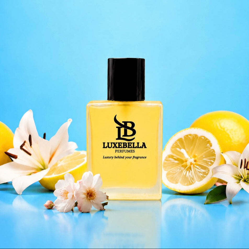 A bottle of Luxebella Perfumes with a black cap and yellow liquid, set against a bright blue background with decorative lemons and white flowers.