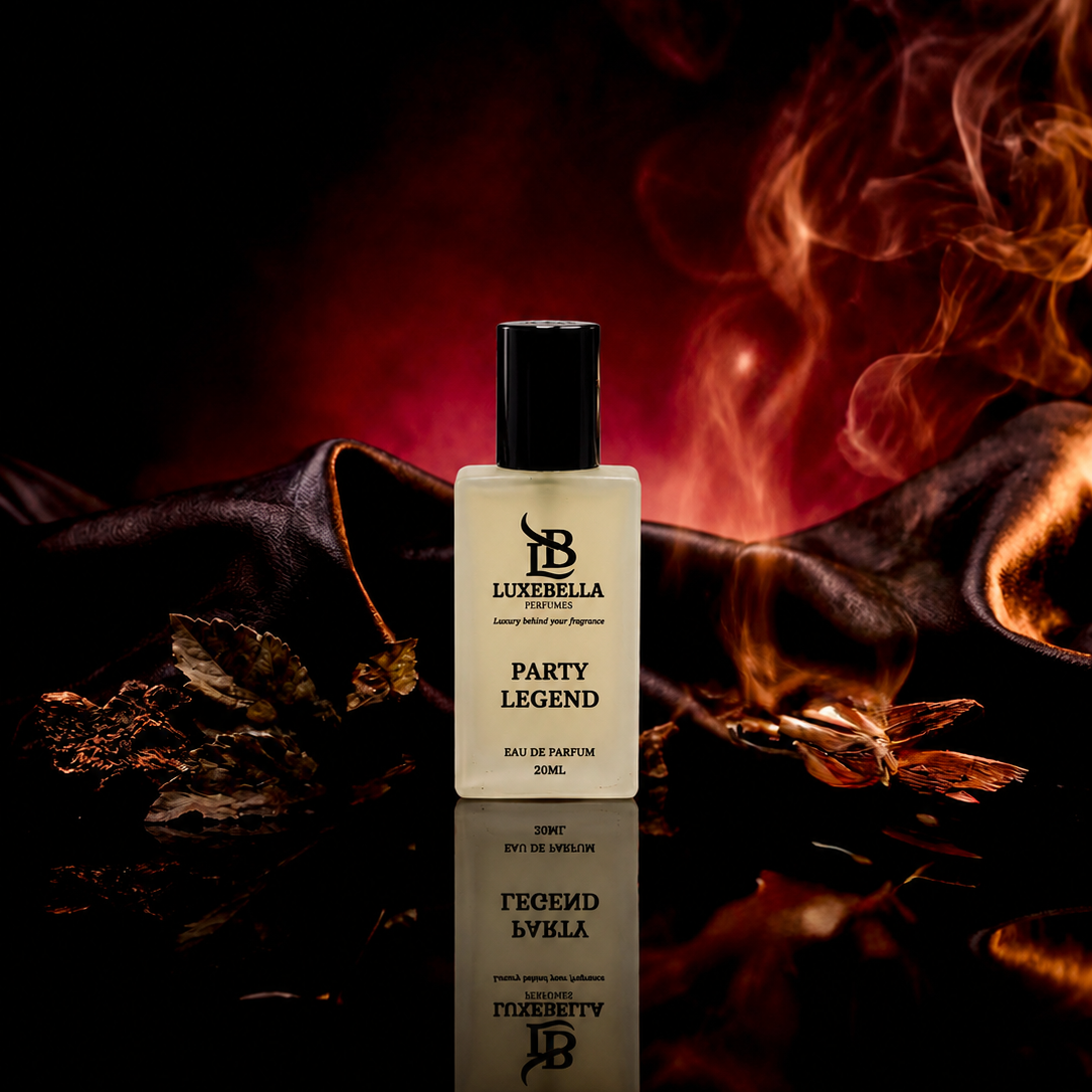 Luxabella Party Legend Eau de Parfum bottle displayed on a reflective black surface with dramatic red and orange flames and dark leather props in the background.