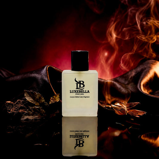Luxebelba London 'Luxury Melt Your Pains' perfume bottle, a frosted glass rectangular container with a black cap, set against a dark background with dramatic red and orange flames and a reflective surface.